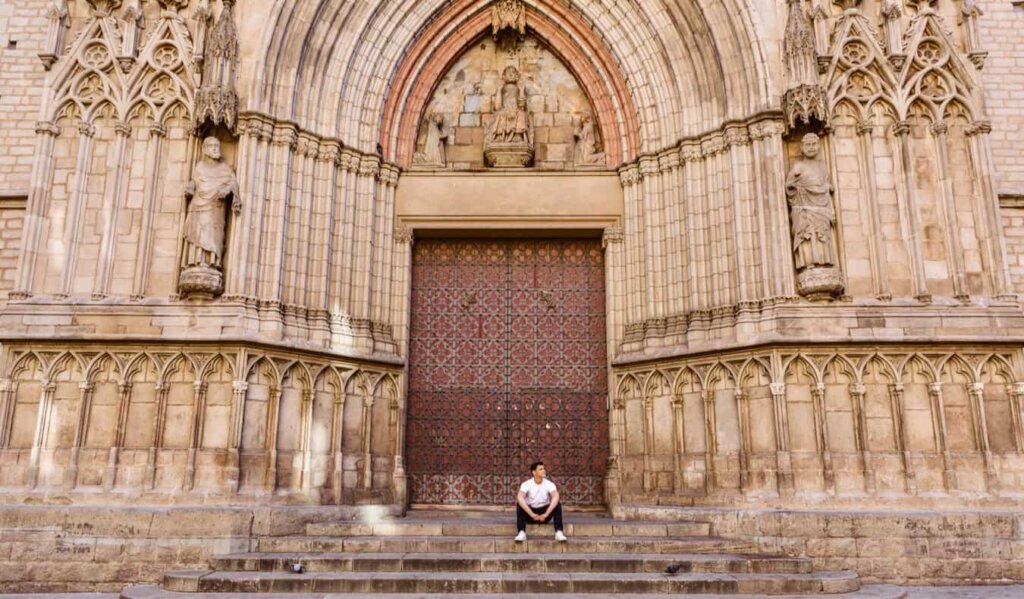 Nomadic Matt alone on a large staircase in Barcelona, Spain