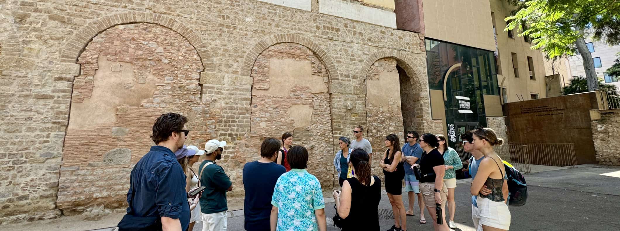 A group of travelers on a walking tour around Barcelona, Spain