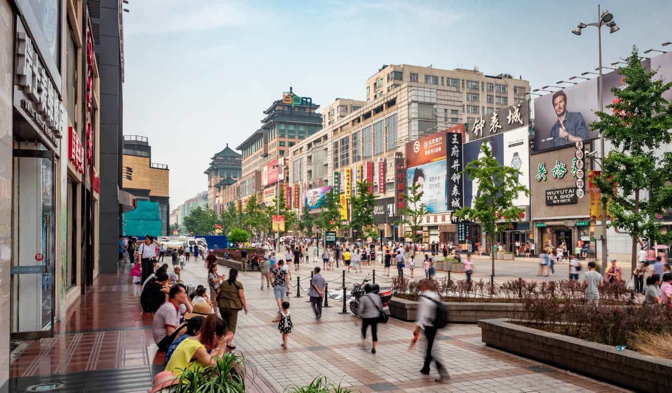 Shoppers at Wangfujing Walking Street, the most well-known shopping street in Beijing, China