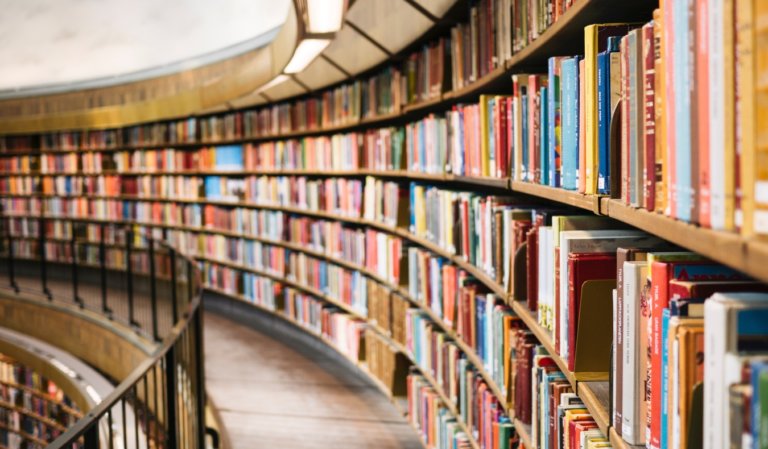 Curved row of bookshelves filled with books