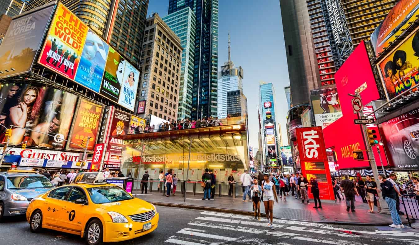 The TKTS Booth surrounded by signs for Broadway shows in Times Square, NYC