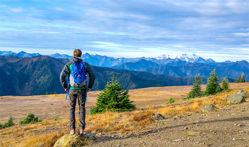 A guy with a backpack on a hike