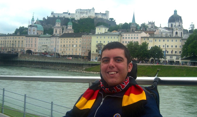 Cory Lee posing for a photo in his wheelchair in Europe