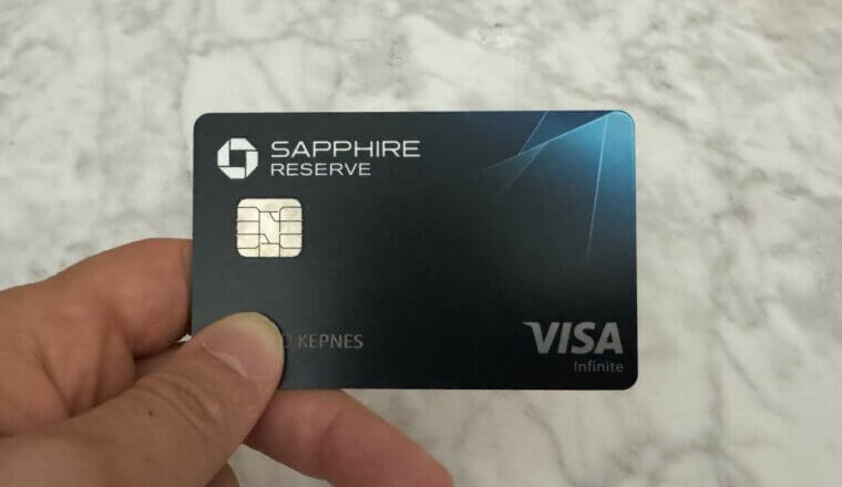 Nomadic Matt holding a Chase Sapphire Reserve credit card