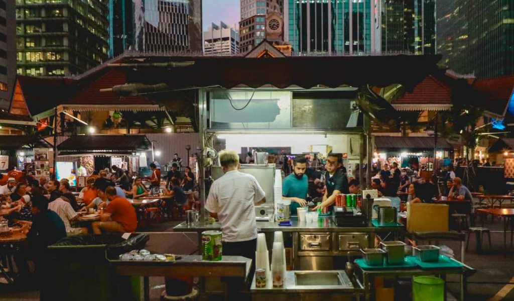 A food hawker in ASia serving delicious local food