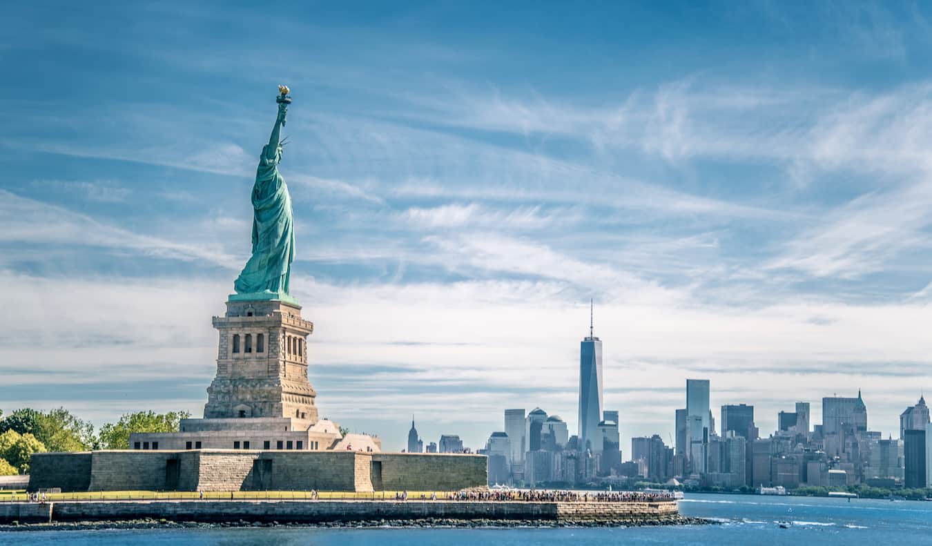 The towering Statue of Liberty in New York City on a bright and sunny day