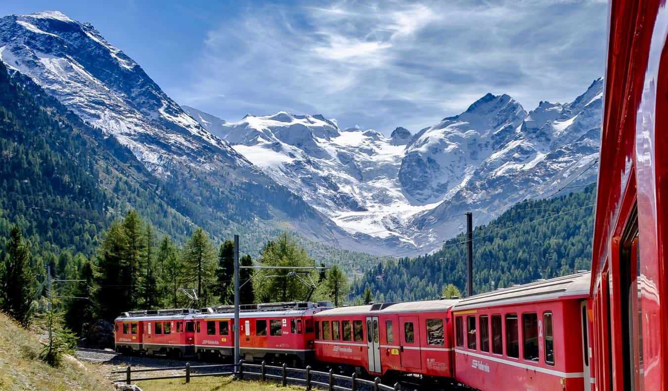 a train traveling over the rugged mountains on Europe on a Eurail trip