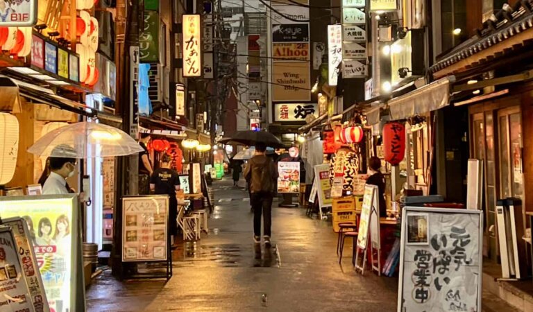 A quiet narrow alley in Tokyo, Japan with bars lining the street