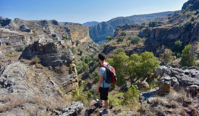 Nomadic Matt hiking in a rugged lanscape in Madagascar, Africa