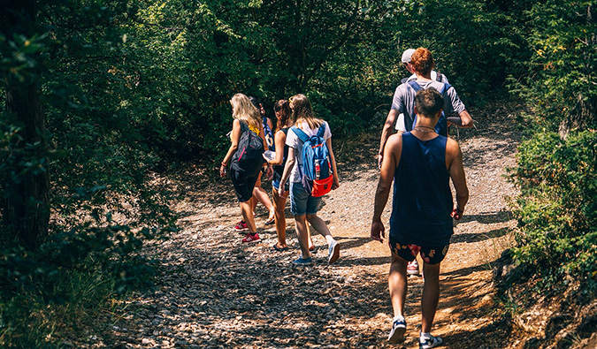 a group of travelers hiking in a forest