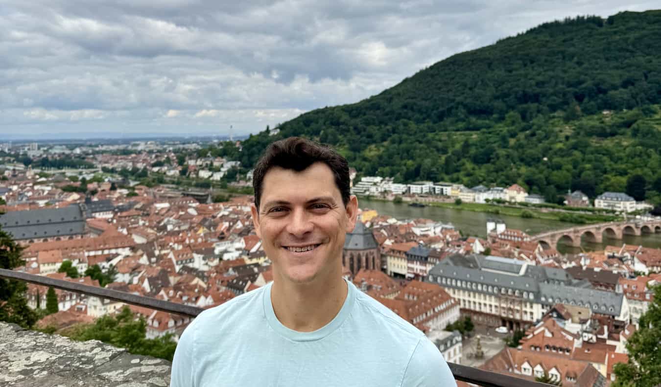 Nomadic Matt posing in a small town in Germany's Black Forest region on a sunny summer day