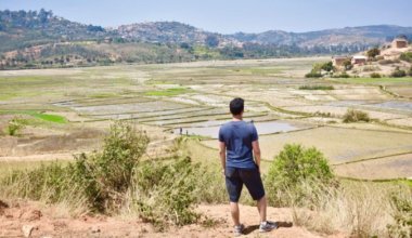 Nomadic Matt standing on a small hill in Africa