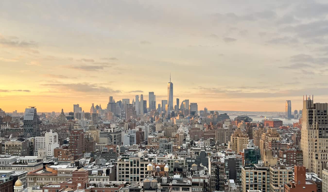 a view over the towering NYC skyline during sunset