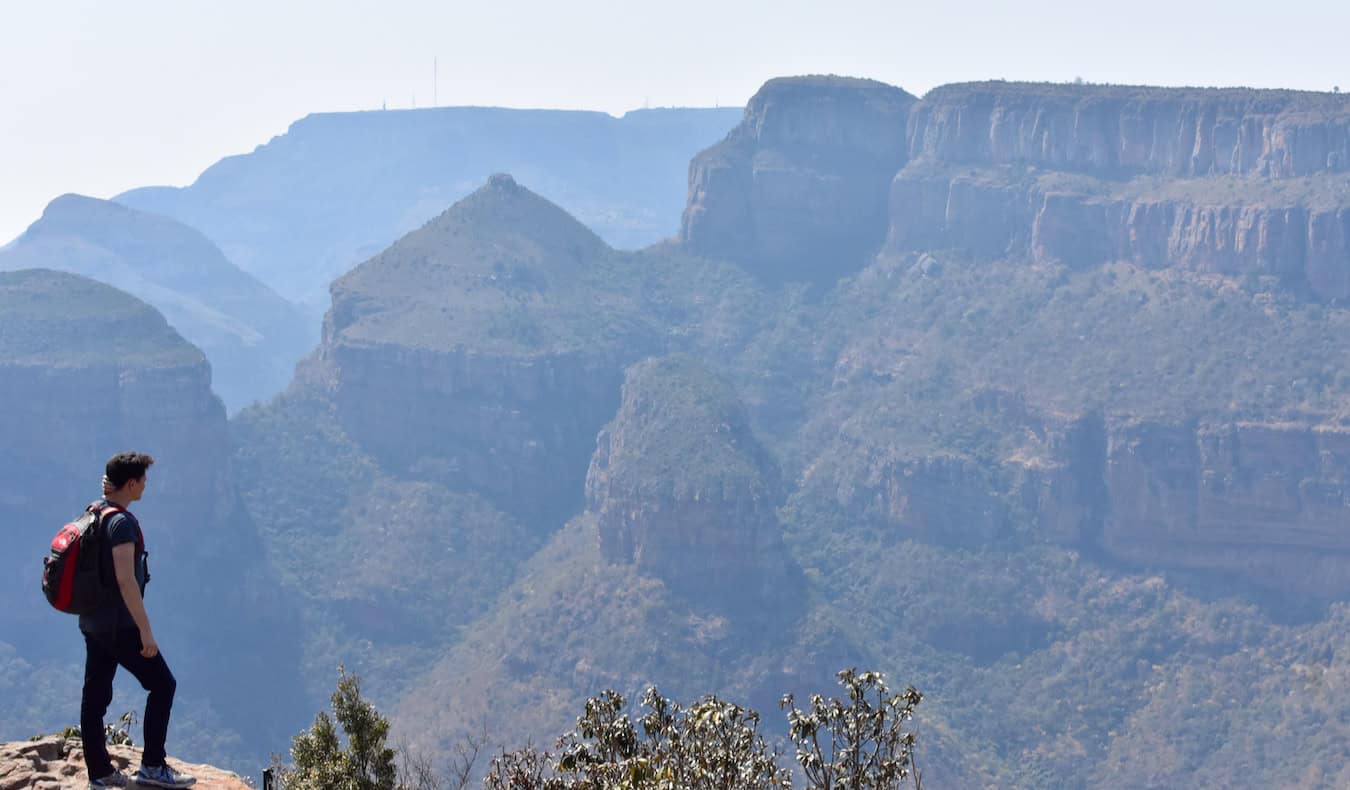 Nomadic Matt hiking in a massive canyon in beautiful Madagascar