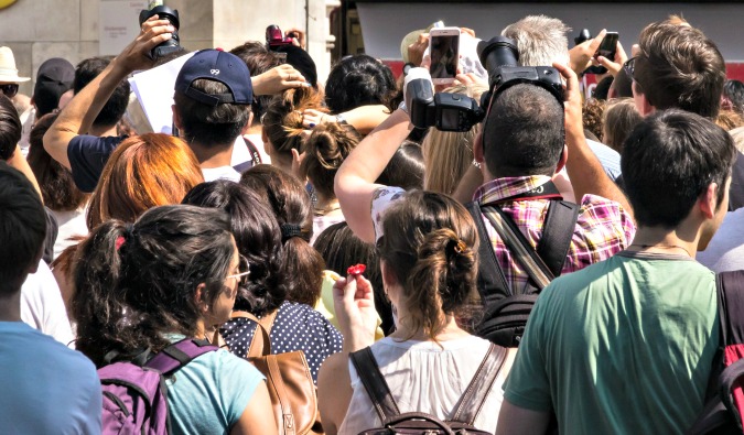 A huge crowd of people taking photo of the Mona Lisa