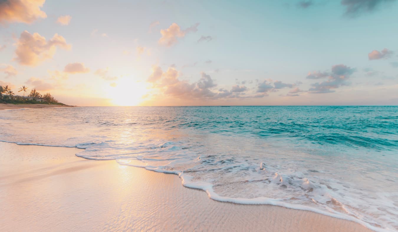 A clear, empty beach at sunset in Hawaii, USA