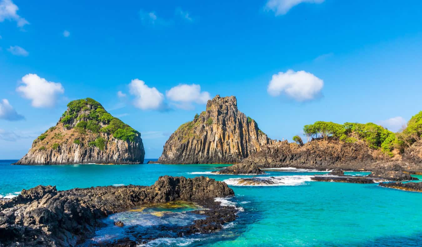 The rugged and rocky coast of Fernando de Noronha in Brazil, on a bright and sunny day