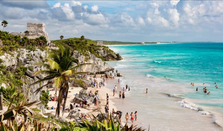 The famous beaches of Tulum, Mexico with Mayan ruins looming on the cliff above