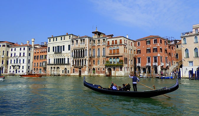 A gondola cruising along the waters of beautiful Venice, Italy