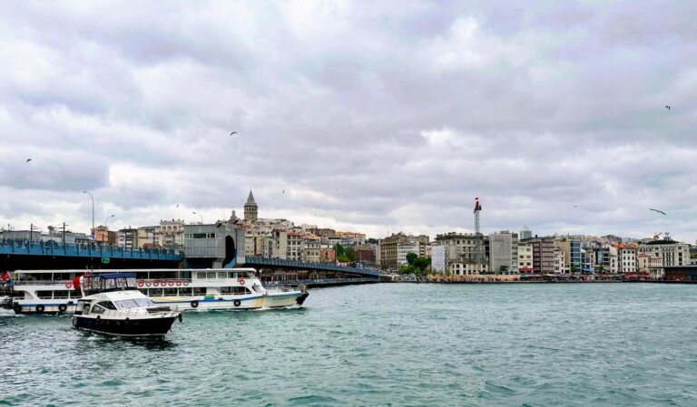 skyline of Istanbul from the water, with boats in the forefront